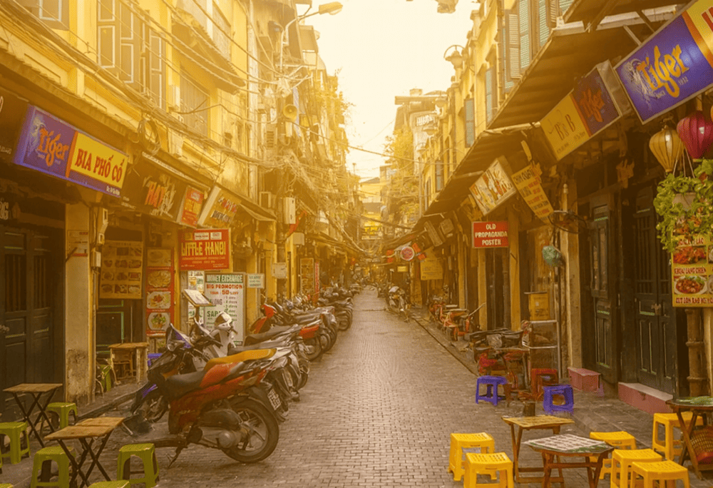 Visitors can enjoy local snacks and cold beer while soaking up the vibrant energy of Ta Hien Beer Street